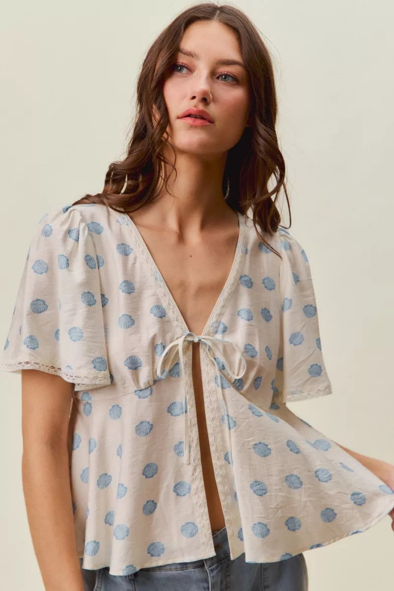 Ivory Shell Print Tie Front Flutter Sleeves Blouse by So Me