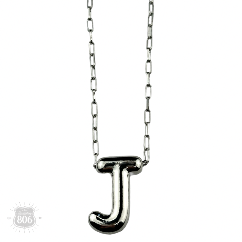 Silver letter pendant on necklace, initial monogram