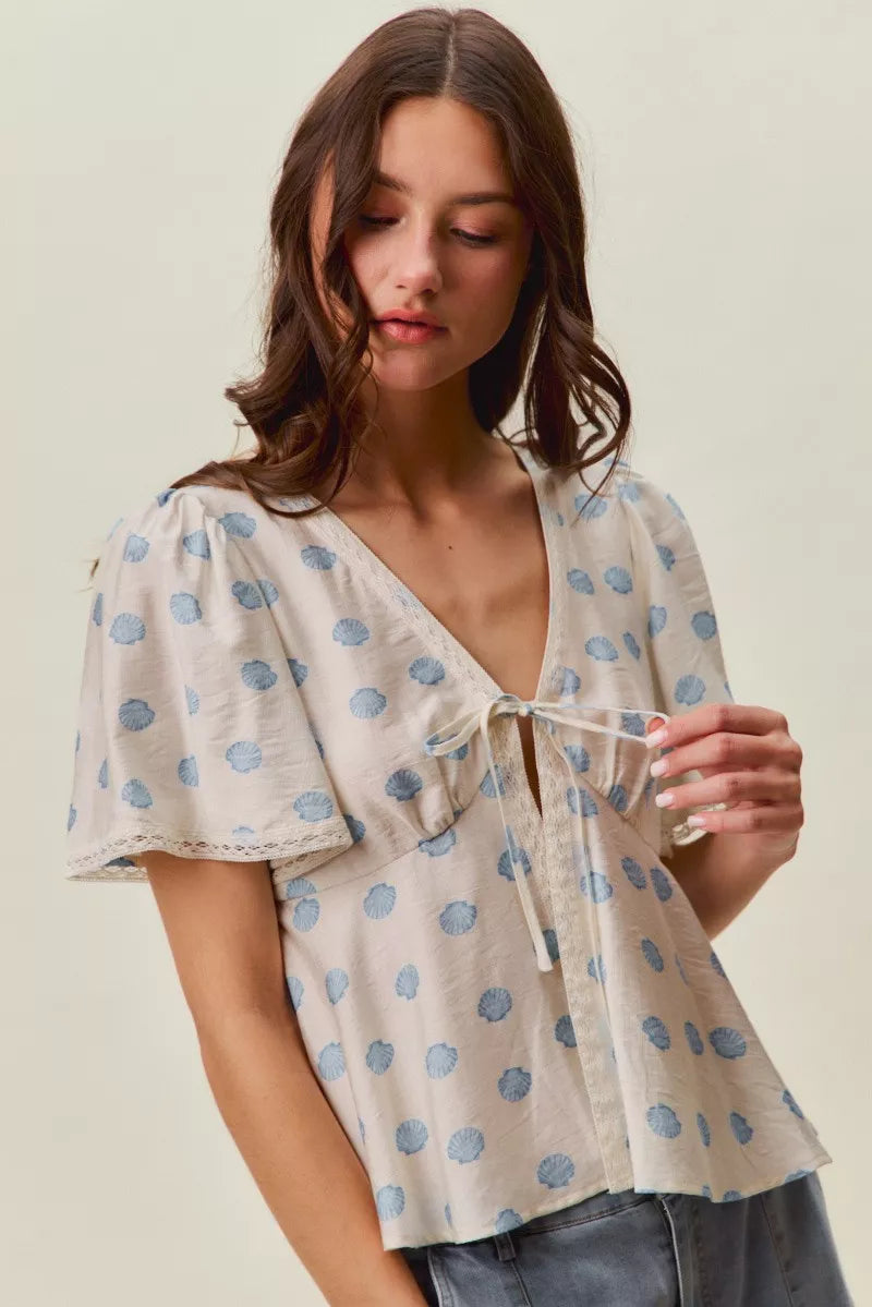 Ivory Shell Print Tie Front Flutter Sleeves Blouse by So Me