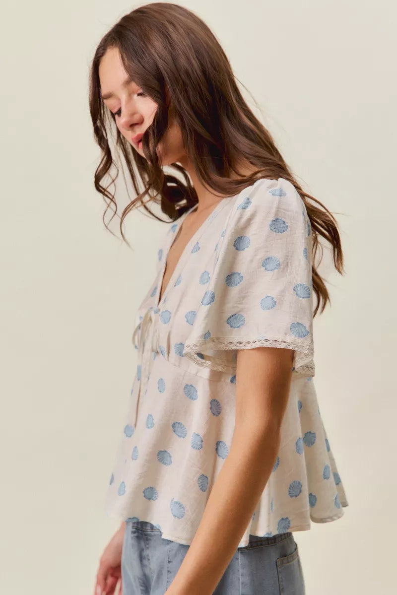 Ivory Shell Print Tie Front Flutter Sleeves Blouse by So Me