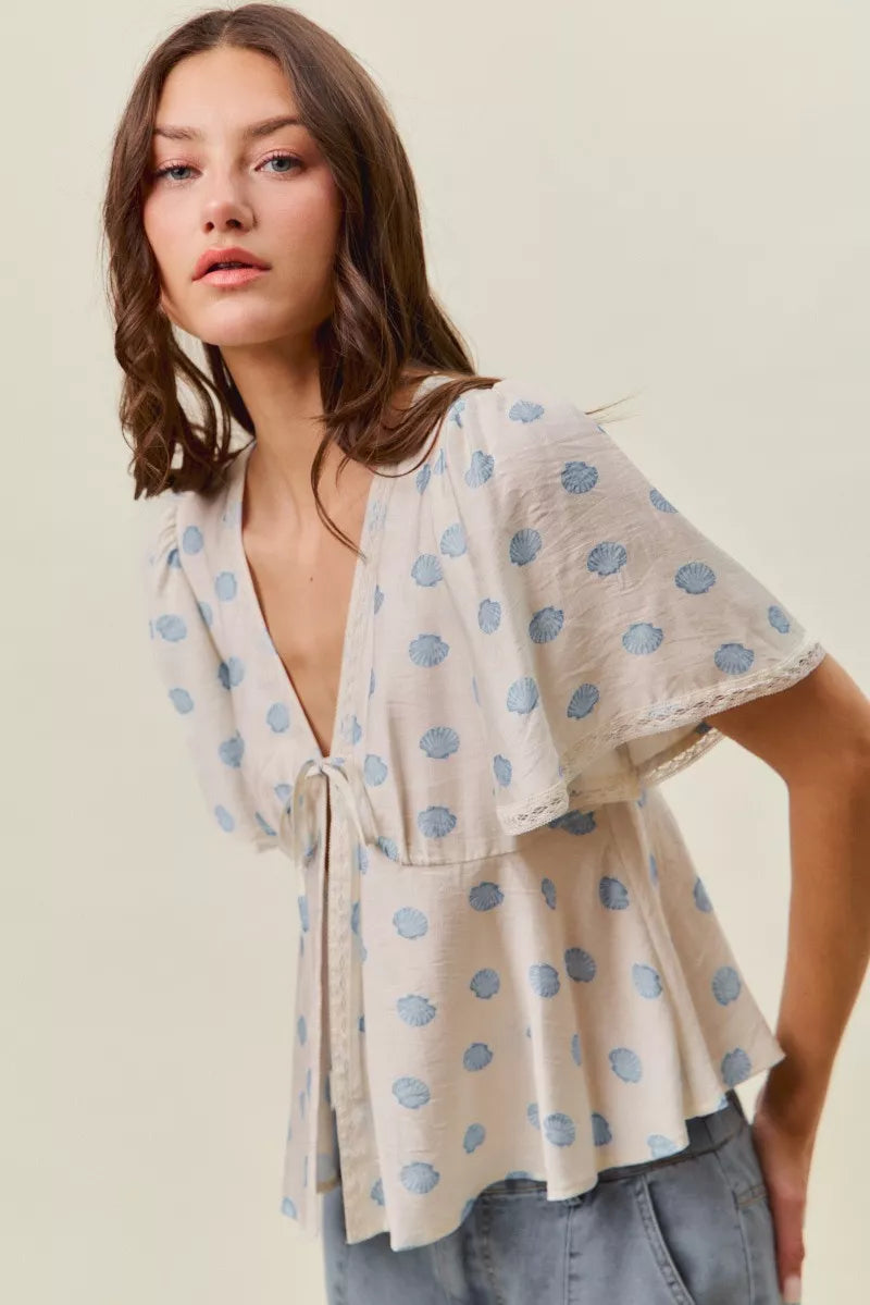 Ivory Shell Print Tie Front Flutter Sleeves Blouse by So Me