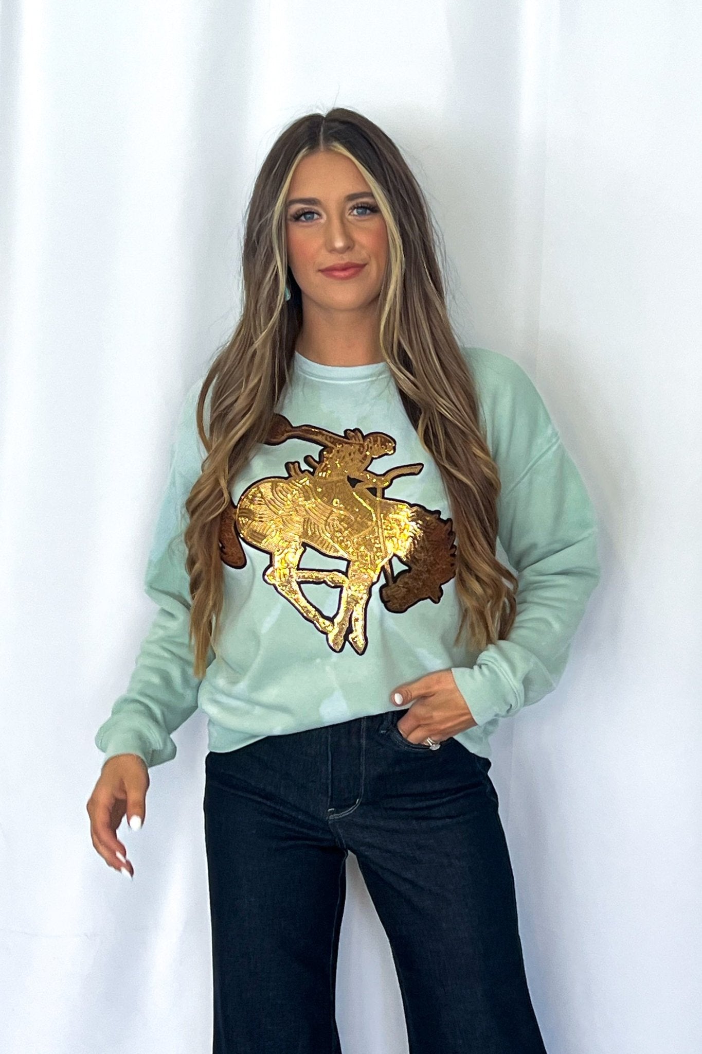 Crazy Consuela "Gold Sequin Horse" Bleached Western Sweatshirt — Bella + Canvas Aqua Sky Background with Cowboy Patch
