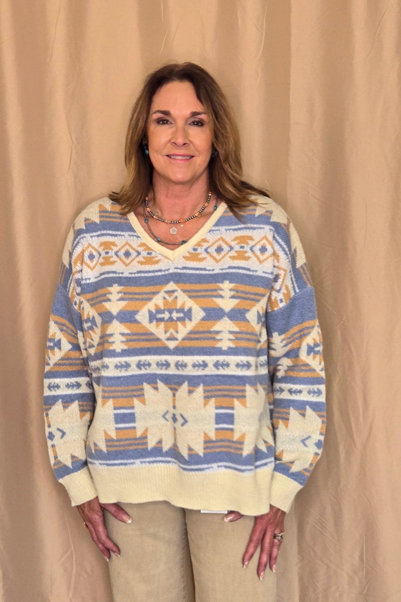 Main Strip Southwestern Knit Sweater — Oversized V-Neck with Bold Blue, Tan & Cream Print